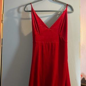 Long curvy red Fashion Nova dress with leg slit. Worn once for prom